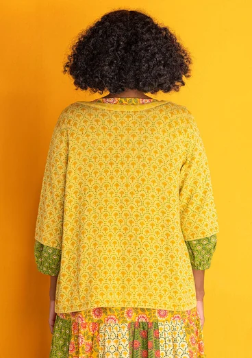 Stickad kofta "Haldi" i ekologisk bomull - mango