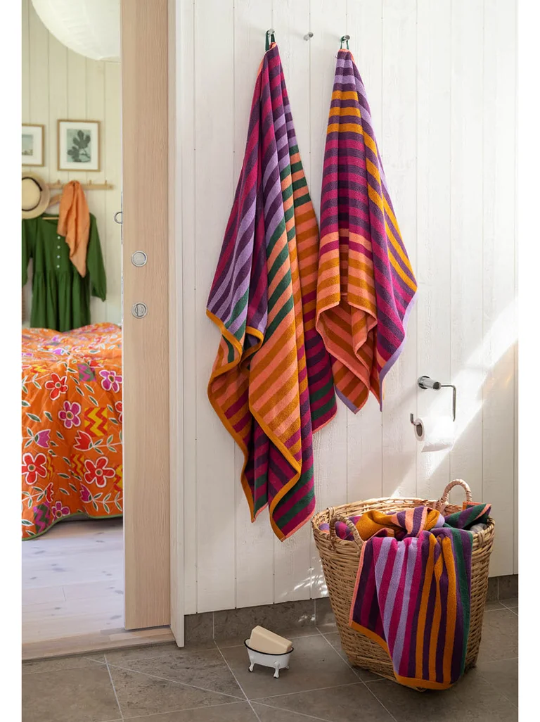 Striped terry towels from Gudrun Sjödén in a bathroom.