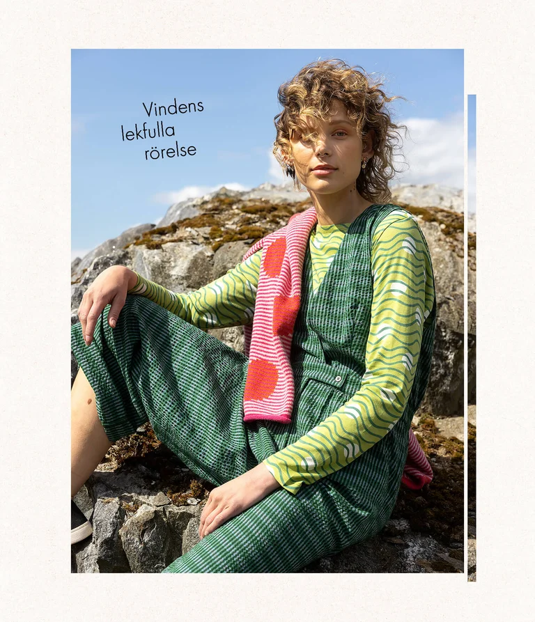 A woman wearing a green jumpsuit from Gudrun Sjödén. 