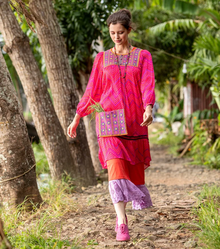 A collage of women wearing patterned clothing from Gudrun Sjödén.