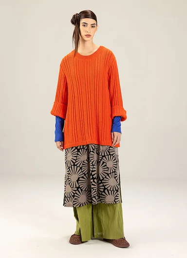 A woman wearing layers of clothing from Gudrun Sjödén’s spring extra collection 2026. 