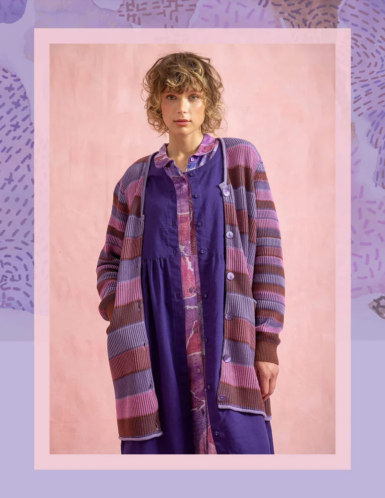 A woman wearing a striped and dotted sweater from Gudrun Sjödén.