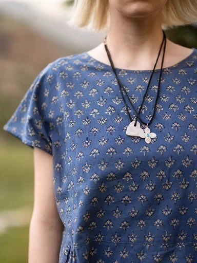 A woman wearing a block-printed dress from Gudrun Sjödén. 
