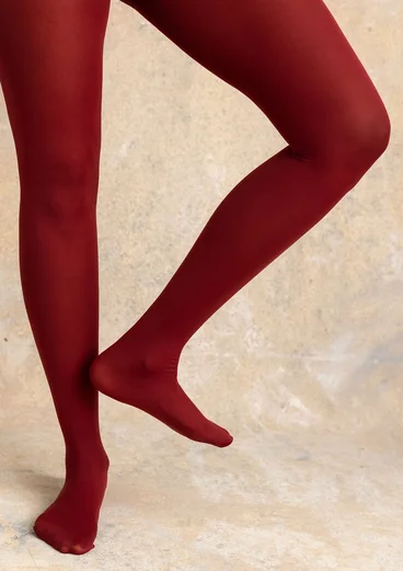 Enfärgade strumpbyxor i återvunnen polyamid - mörk agatröd