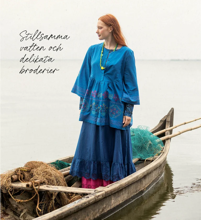 A woman wearing a graphic-patterned dress from Gudrun Sjödén.  