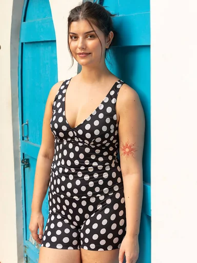 A woman wearing dotted swimwear from Gudrun Sjödén. 