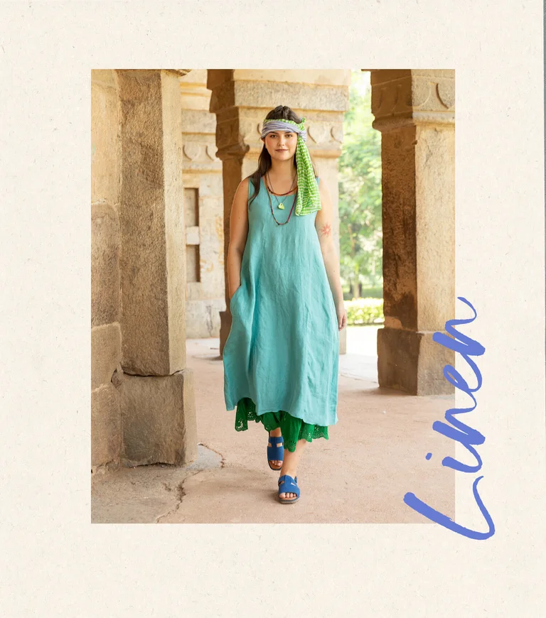 A woman wearing a light blue dress from Gudrun Sjödén. 